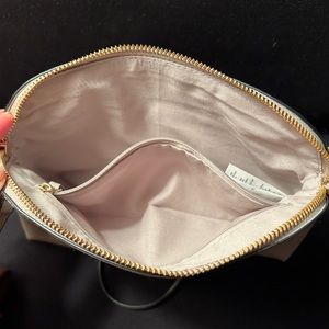 10x6.5 inches clutch and long strap.